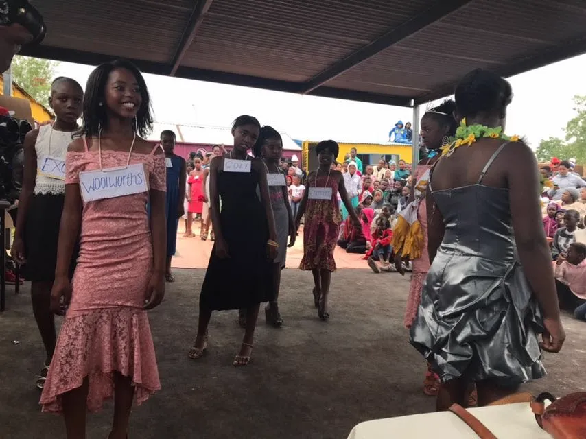 Kids modelling on a runway at the community fashion day