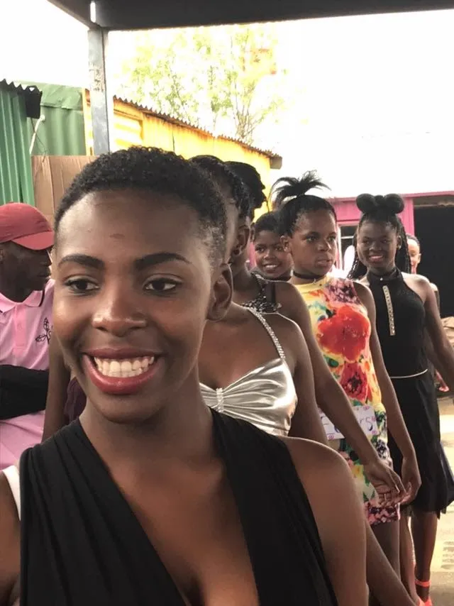 Young women lining up for the community fashion show