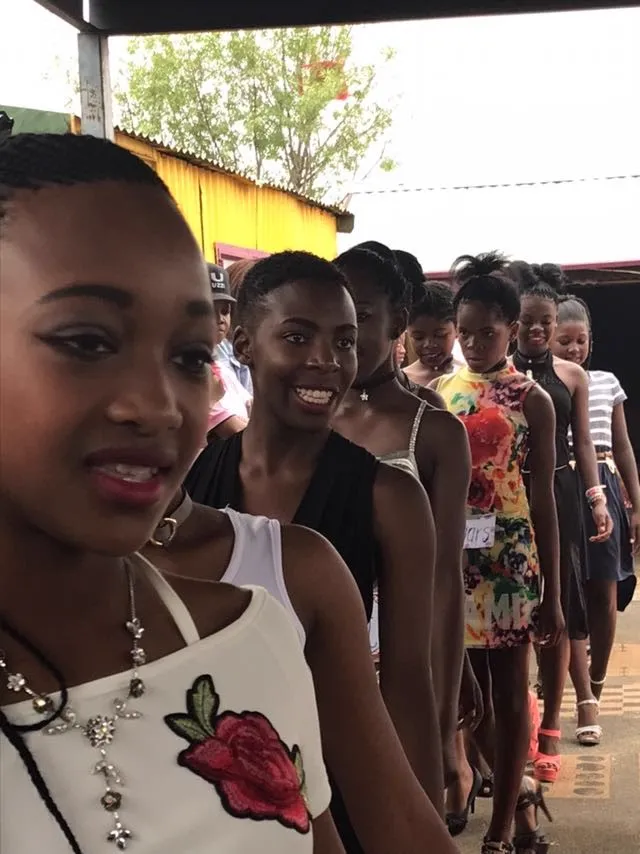 Young women waiting their turn on the runway