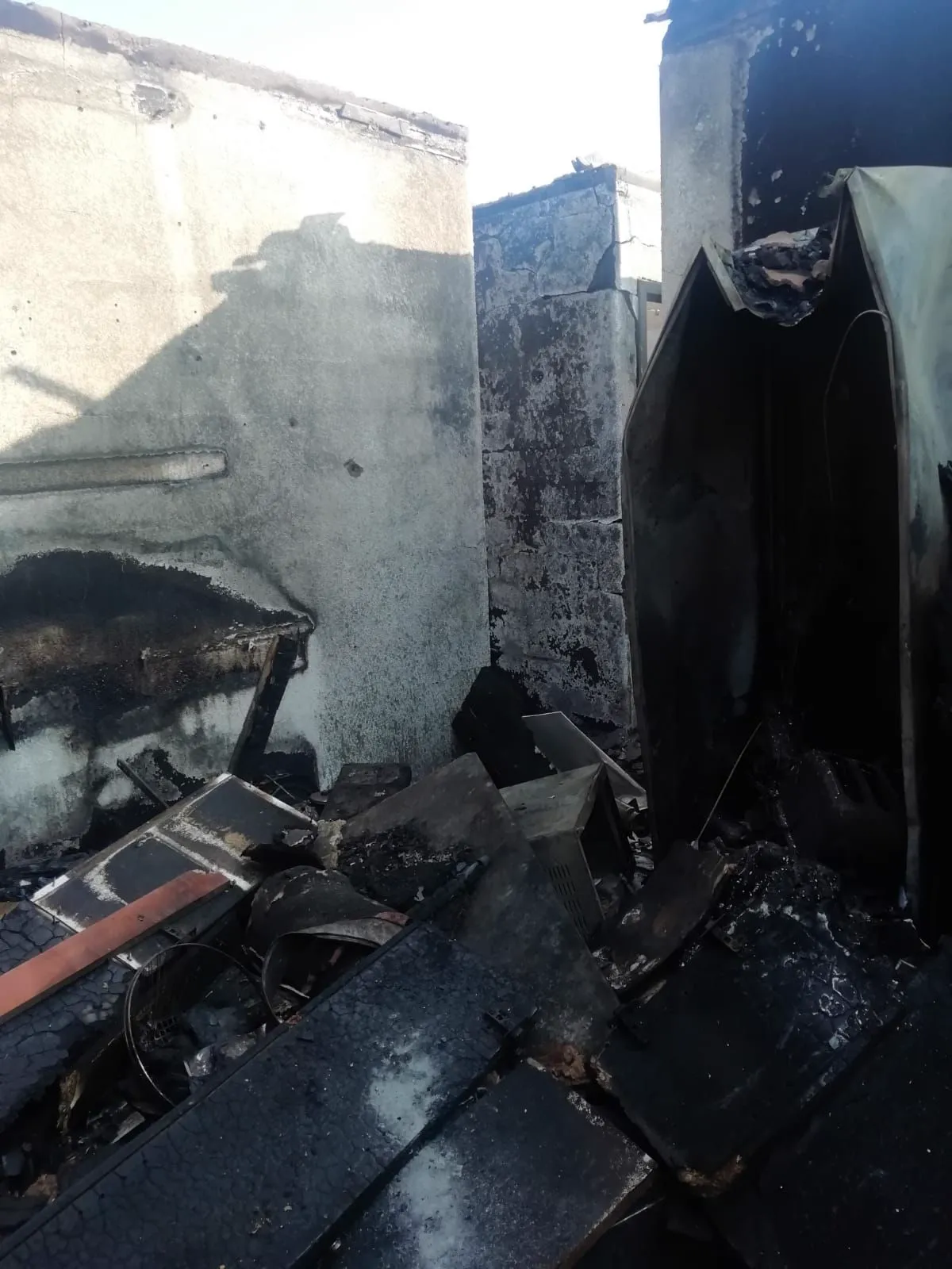 Burnt debris and fittings inside the house
