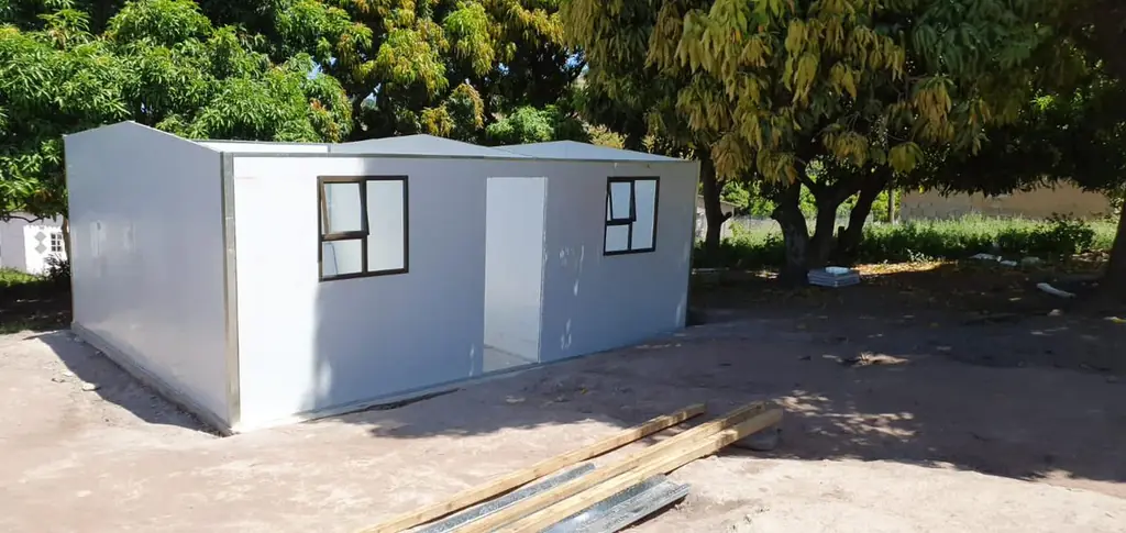 A completed UDRS unit under tree cover